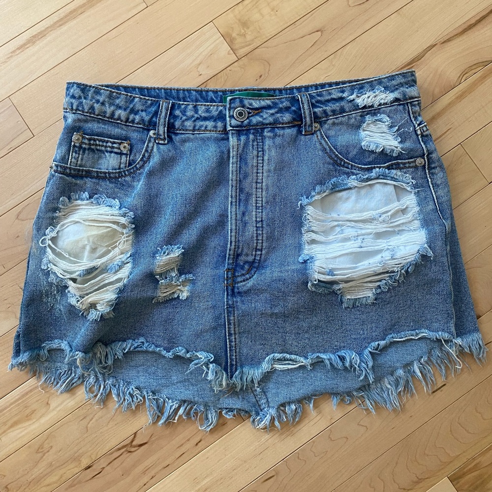 Distressed denim mini skirt